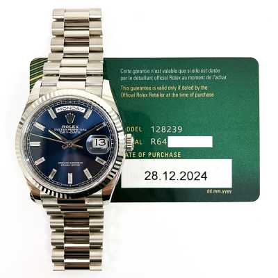 Rolex Day-Date in white gold with blue dial and baguette diamonds