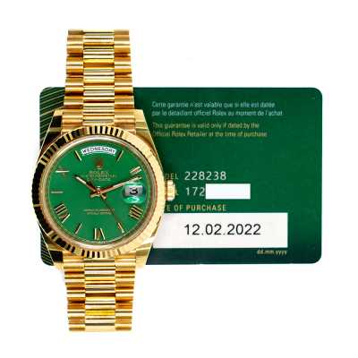Rolex 228238 Day-Date 40mm yellow gold featuring green Roman dial and President bracelet pre-owned luxury