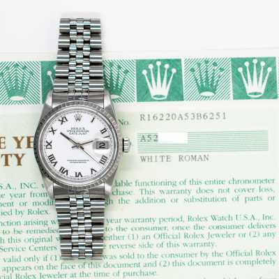 Rolex Datejust reference 16220 steel with engine-turned fluted bezel and Roman dial pre-owned