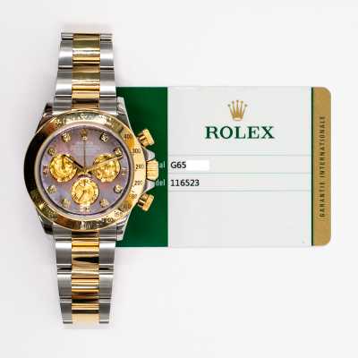 Rolex 116523NG Daytona 40mm Rolesor chronograph featuring black MOP dial and diamonds pre-owned luxury